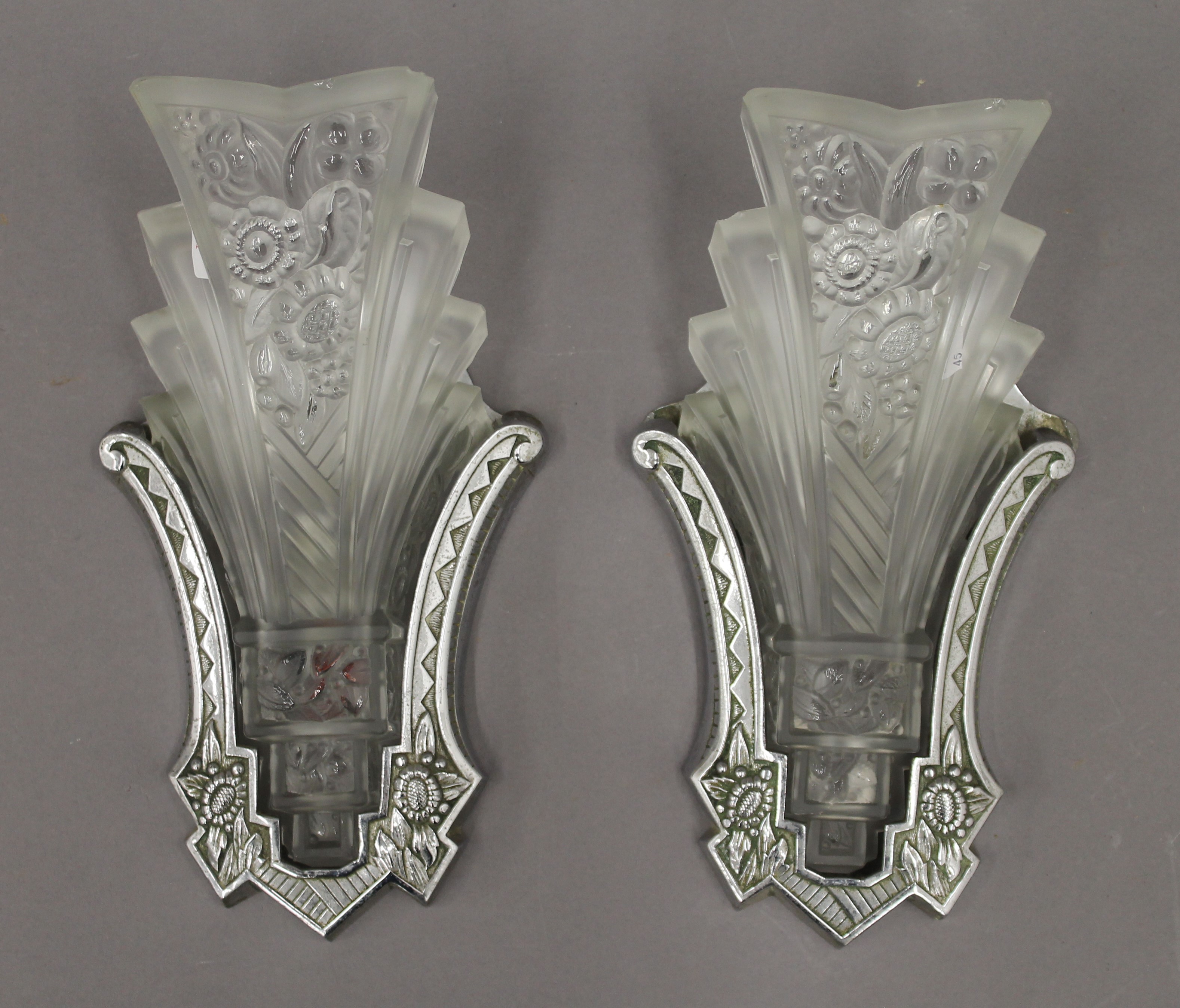 Two Art Deco glass and chrome wall lights. Each approximately 30 cm high.