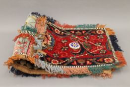 A hand knotted woollen mounted saddle bag. Approximately 118 cm long.