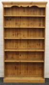 A modern pine bookcase. 98.5 cm wide x approximately 178 cm high.