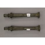 A pair of small scale cast bronze models of canons,