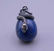 A silver and lapiz egg pendant. 3 cm high.