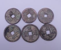 Six Chinese coins.