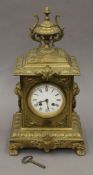 A Victorian brass mantle clock,