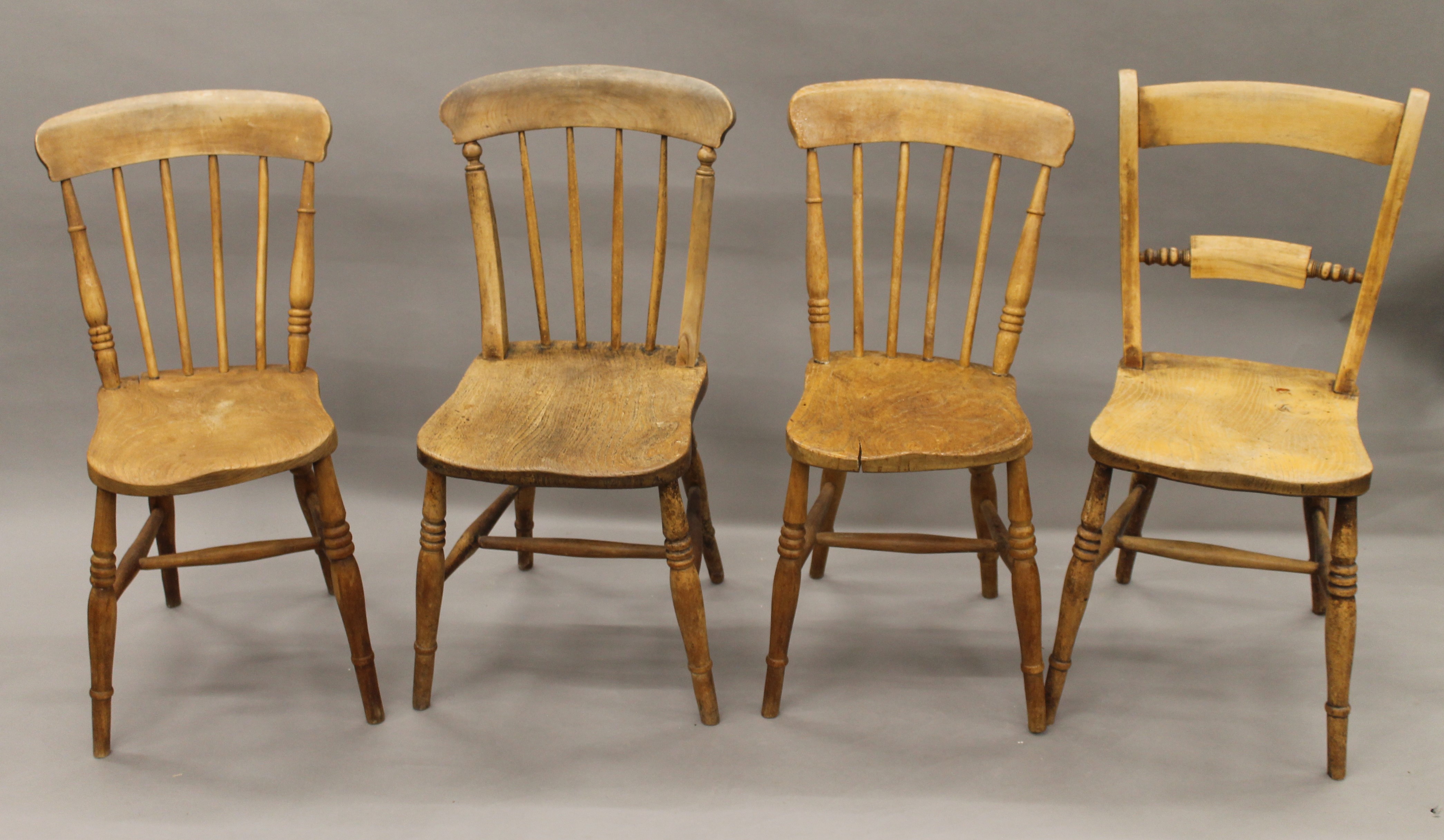 Four various Victorian elm seated kitchen chairs.