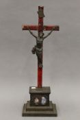 A 19th century Continental enamel decorated iron crucifix. 61 cm high.