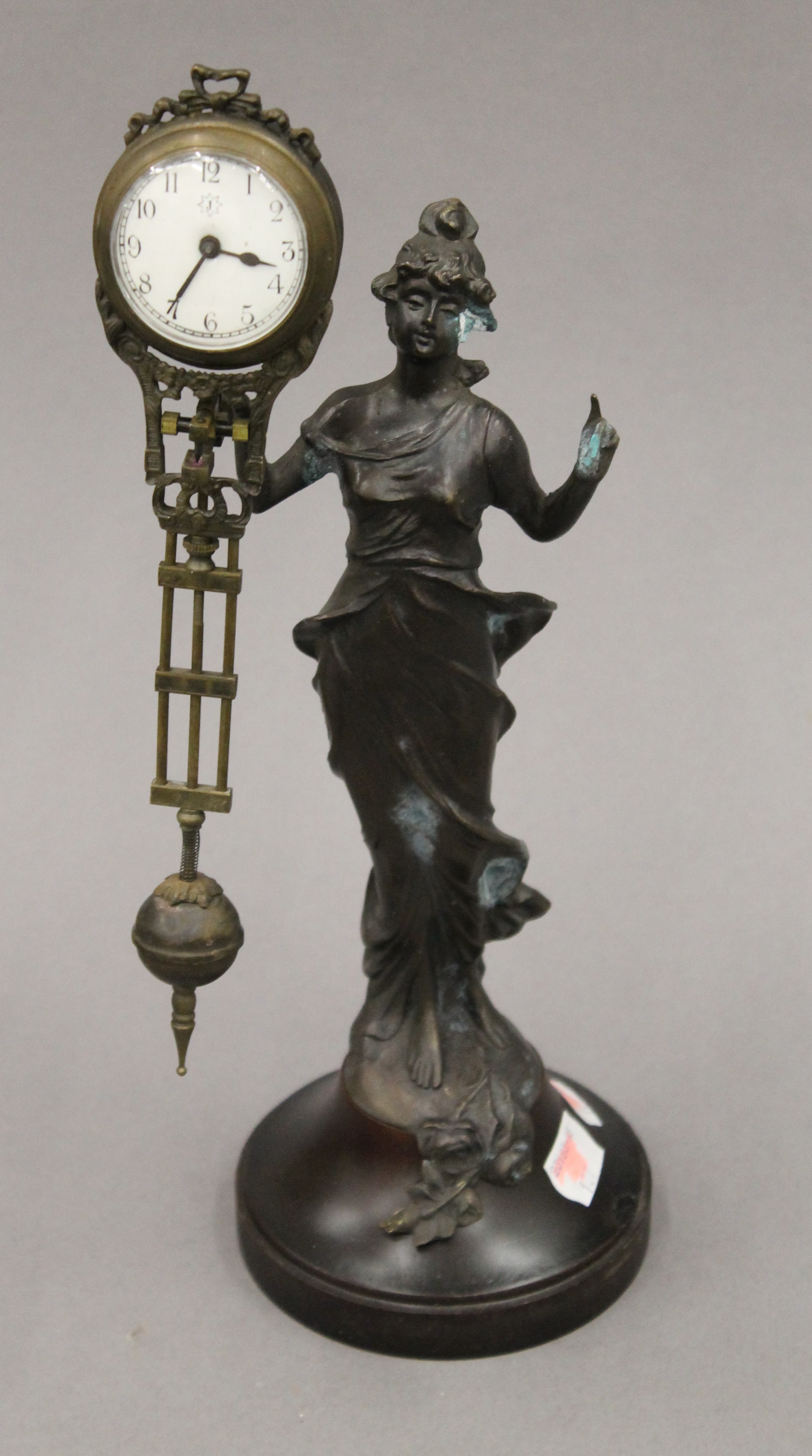 A Diana swing clock. 28 cm high.