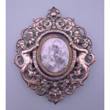 A 19th century copper and enamel plaque in a 19th century frame. 10.5 cm high.