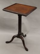 A Georgian mahogany hinged and ratcheted reading/draughtsman's table. 56.5 cm wide.