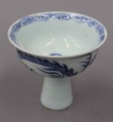 A Chinese blue and white porcelain stem cup. 8.5 cm high.