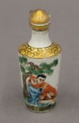 A porcelain erotic snuff bottle. 10 cm high.