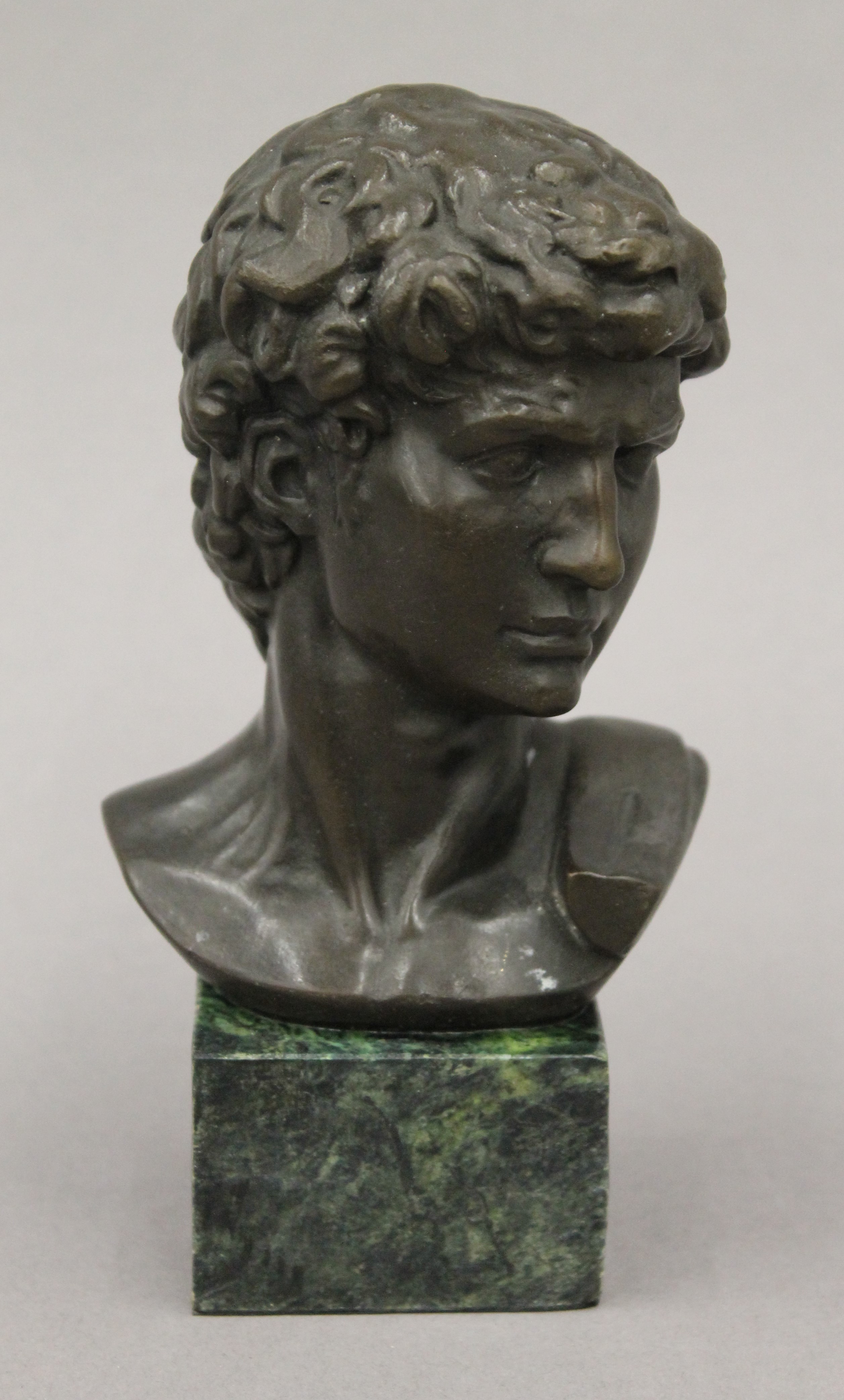 A bronze bust of a classical male. 16.5 cm high.