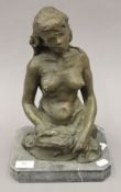 A bronze model of a naked lady. 35 cm high.