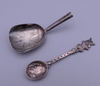 A Georgian silver caddy spoon and a Continental 830 silver teaspoon. The former 8 cm long.