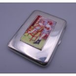 A silver cigarette case depicting nudes. 6 cm wide.