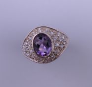 A silver amethyst and cubic zirconia ring. Ring size N/O.