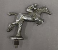 A leaping horse and jockey car mascot. 16 cm high.