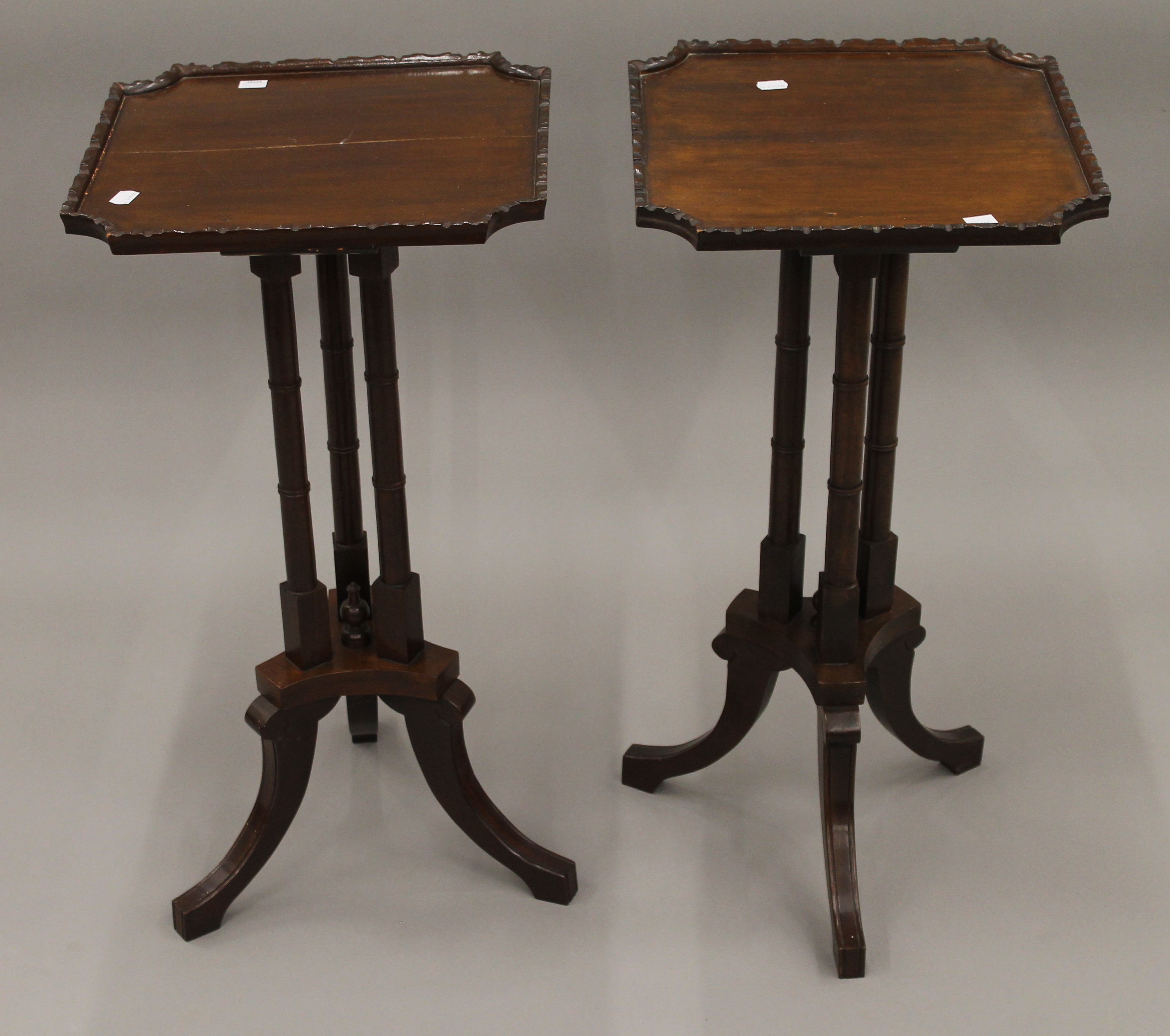 A pair of reproduction mahogany side tables. Each 36.5 cm square., 72 cm high.