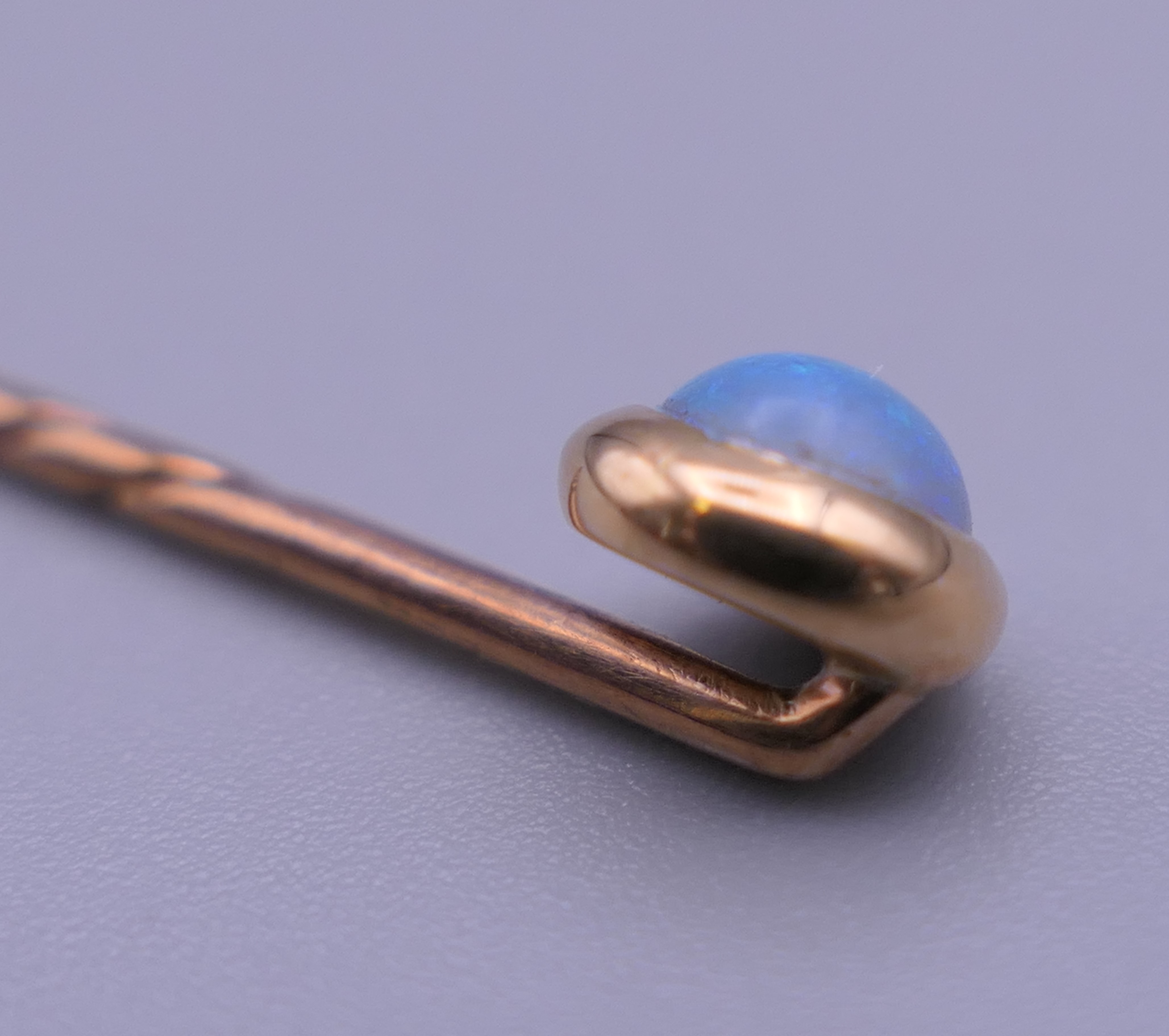 An opal mounted unmarked stickpin, housed in a leather box. 5.5 cm long. - Image 3 of 9