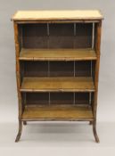 A Victorian bamboo open bookcase. 70 cm wide, 31.5 cm deep, 108 cm high.