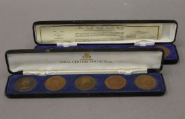 Two cased sets of coins.