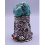 A Tibetan silver and turquoise seal. 8 cm high.