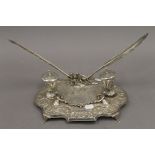 A 925 silver desk stand. 28 cm wide. 28.8 troy ounces total weight.