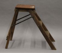 A set of small vintage folding steps. 51 cm high.