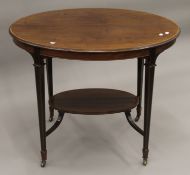 A Edwardian mahogany oval centre table. 89 cm long.