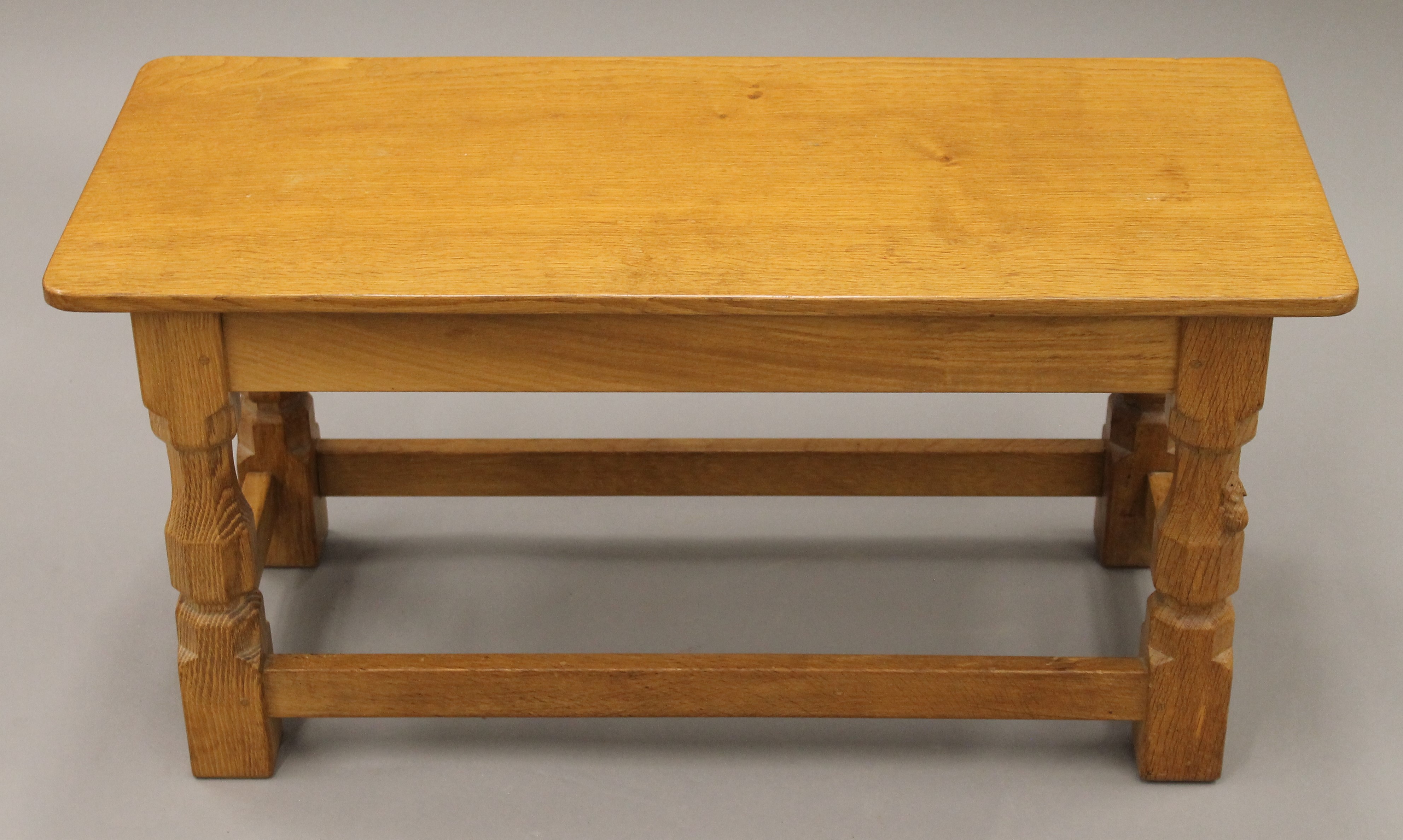 A Robert 'Mouseman' Thompson of Kilburn rectangular adzed oak coffee table. 82 cm long, 35.