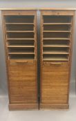 A pair of early 20th century oak tambour front cabinets. Each 143 cm high.