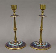 A pair of cloisonne brass candlesticks. 21.5 cm high.