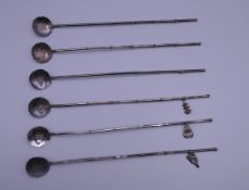 A set of six Chinese silver spoons. Each 22 cm high.