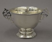 A twin handled silver trophy cup. 12 cm high. 12.5 troy ounces.