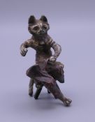 A cold painted bronze model of a cat. 5.5 cm high.