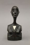 A vintage African carved ebony female bust, with bone inlay. 18 cm high.