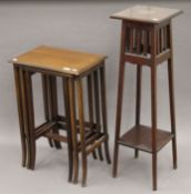 An Edwardian mahogany nest of three tables and an Edwardian mahogany plant stand.