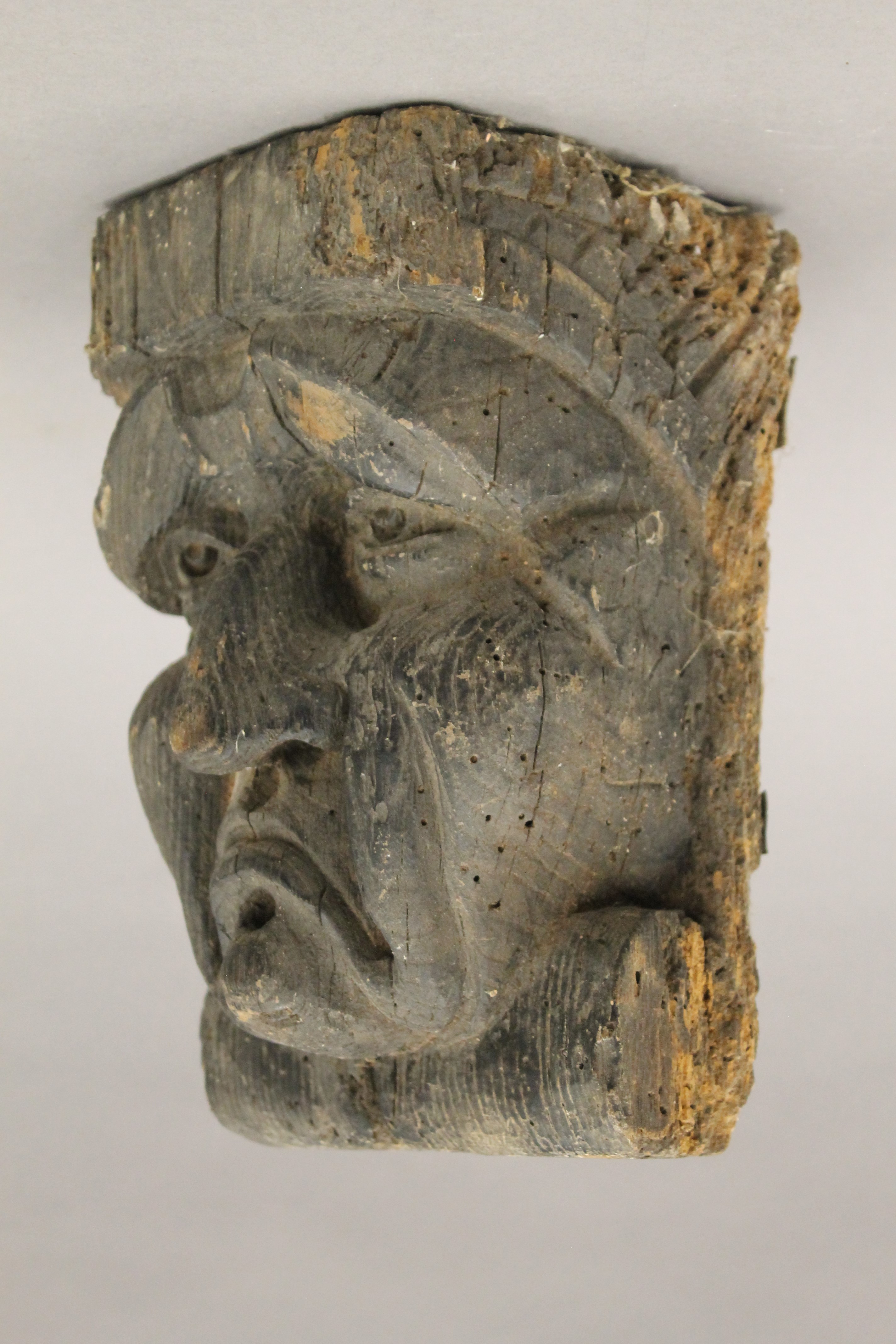 An early carved oak grotesque mask, possibly 17th century or earlier. 23 cm high. - Image 2 of 3