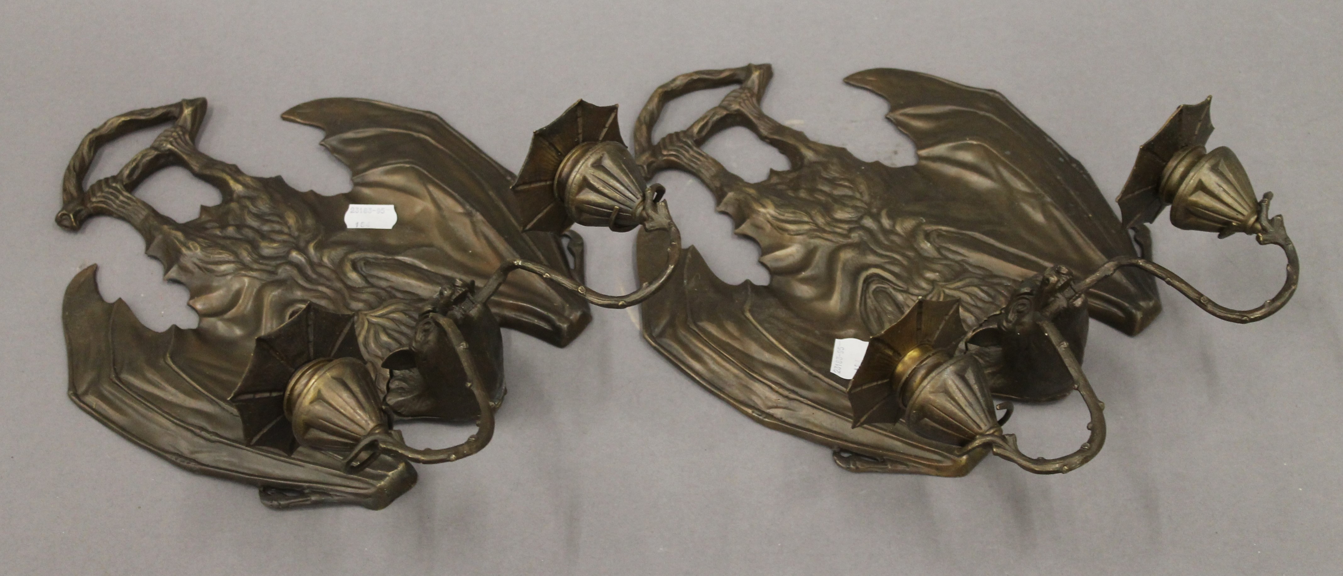 A pair of twin branch wall lights formed as bats. 34 cm high.