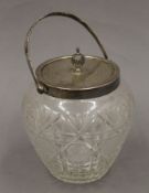 A silver mounted biscuit barrel. 22 cm high overall.