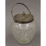 A silver mounted biscuit barrel. 22 cm high overall.