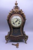 A 19th century Boulle mantle clock. 34 cm high.