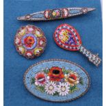 Four vintage Italian micro mosaic brooches. The largest 6.5 cm high.