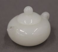 A small model teapot. 3 cm high.