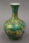 A small Chinese famille verte porcelain vase decorated with figures. 19 cm high.