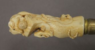 A walking stick with a carved bone handle formed as mice. 87.5 cm long.