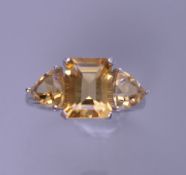 A silver and citrine ring. Ring size P.