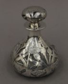 A silver overlay scent bottle. 12 cm high.