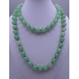 A string of jade beads. Approximately 88 cm long.