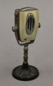 A vintage novelty lighter formed as a microphone. 12 cm high.