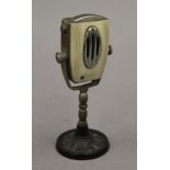 A vintage novelty lighter formed as a microphone. 12 cm high.